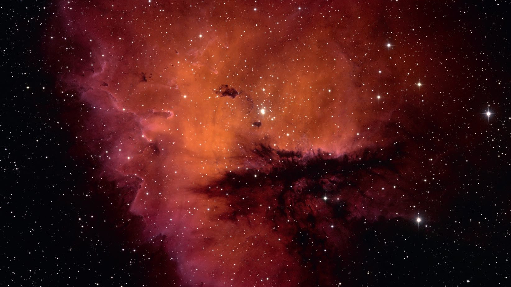 Non solo dal punto di vista fotografico, ma anche visuale, la forma di NGC 281 ricorda la figura di un Pacman. NSF/AURA/WIYN/T. Rector (University of Alaska)